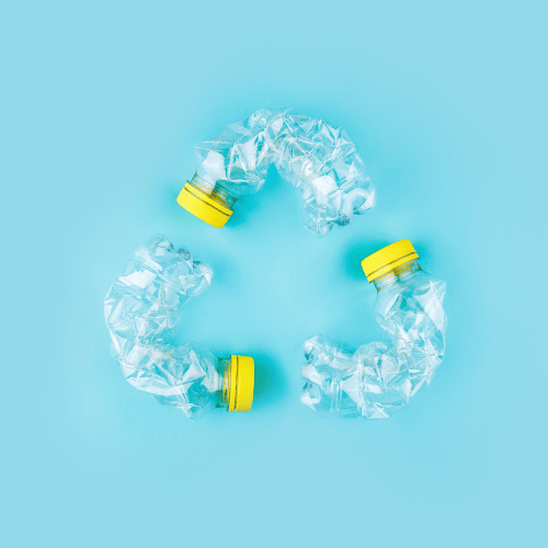 The recycling logo created with plastic bottles