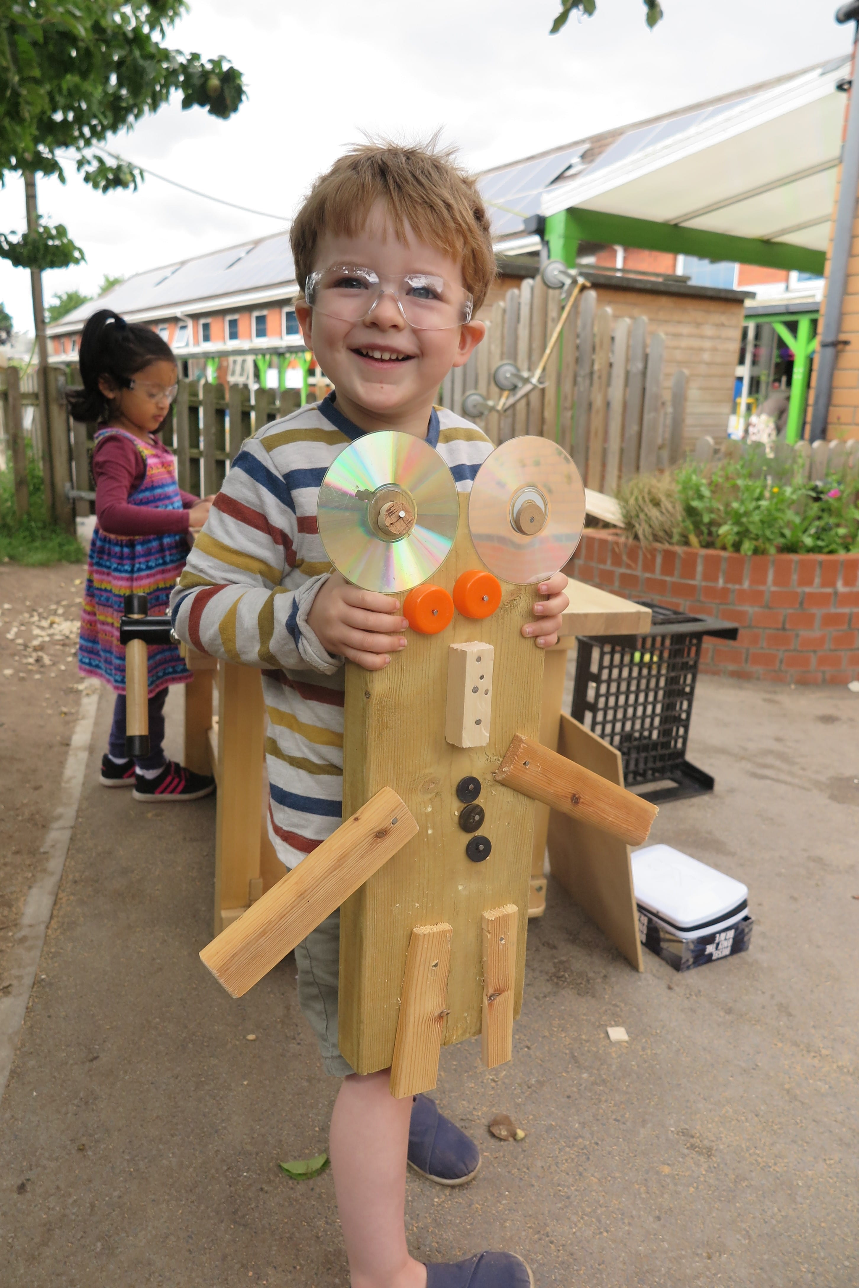 Little boy taking part in a woodwork activity
