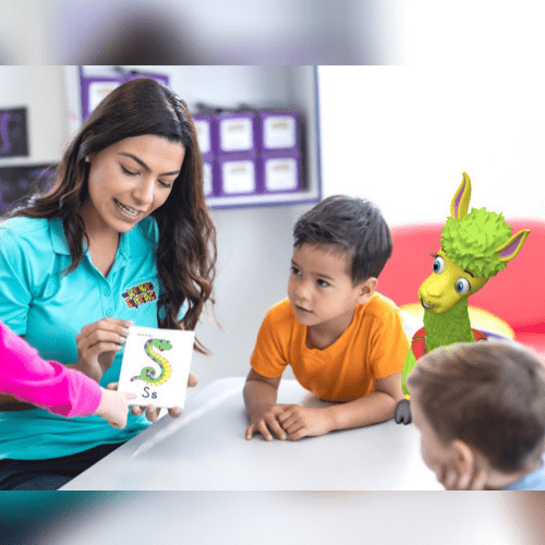 The Learning Experience teacher with pupils and character