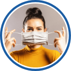 Woman putting on face mask