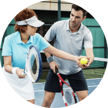 Tennis coaching session in progress