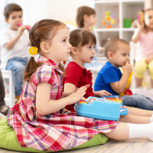 Children in early years setting playing instruments