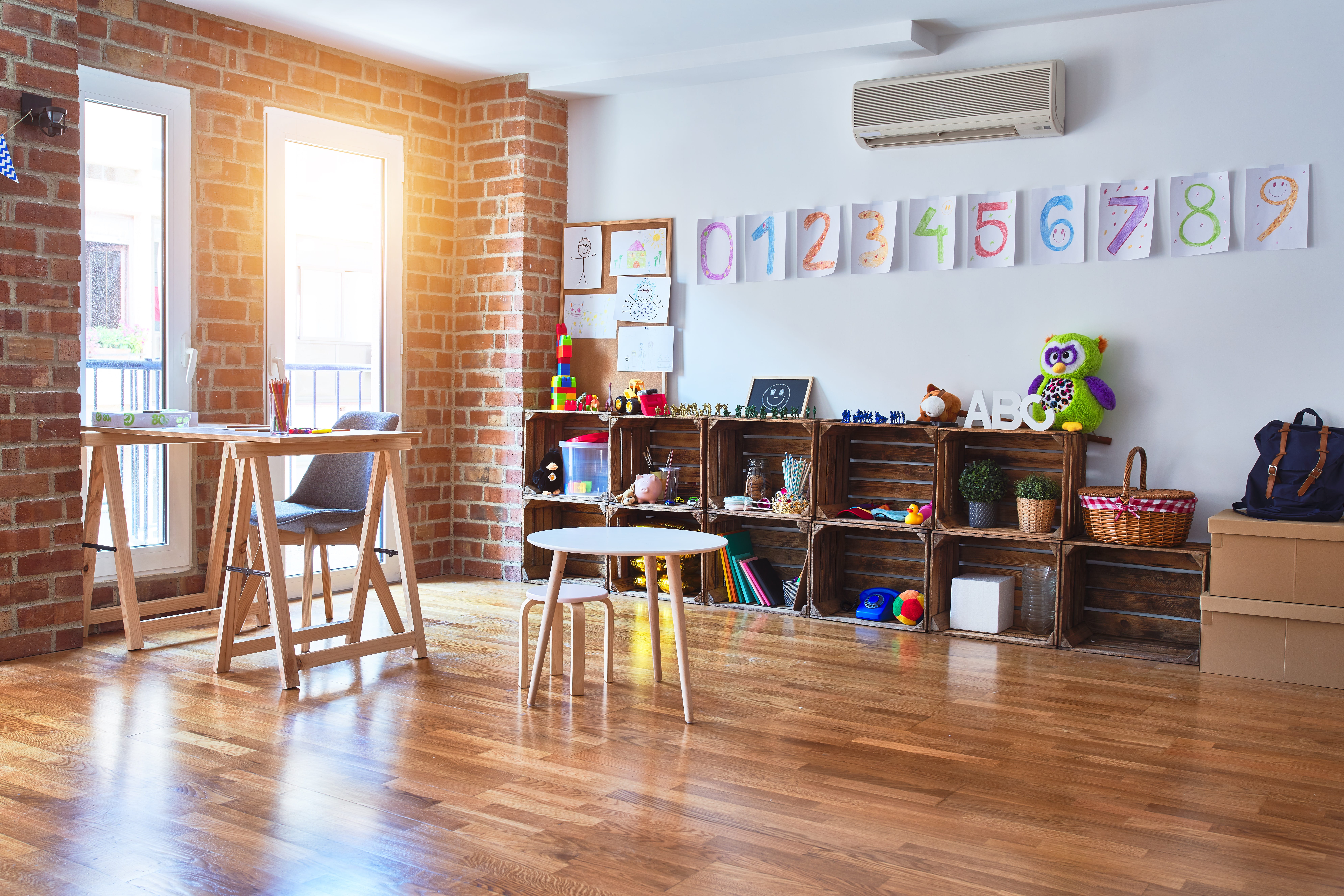 Picture of empty preschool classroom with colourful toys around.