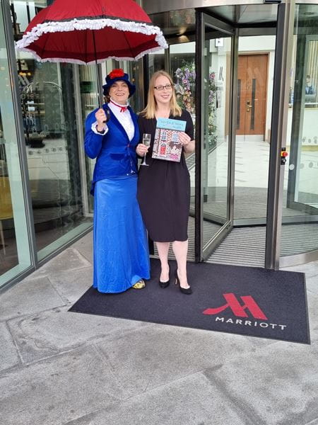 Early years specialist, Maria Culley, standing with lady in Mary Poppins costume to promote her debut book, 'There's a Nanny in MY House!'