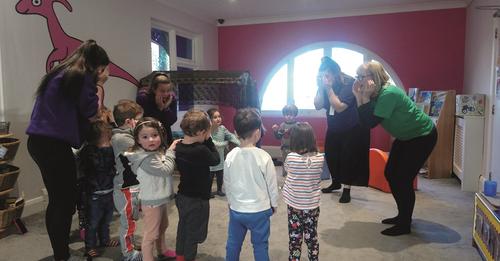 Boogie Mites - The Joy of Music workshop with workshop leaders and children in a circle