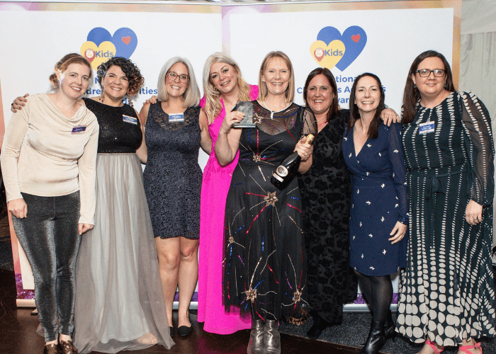 Picture of the Kidslingo team holding one of their awards at The What's On 4 Kids Awards 2023 event