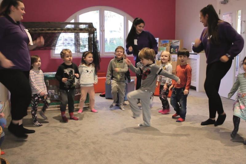 Image of a group of young children taking part in a Boogie Mites music and movement class