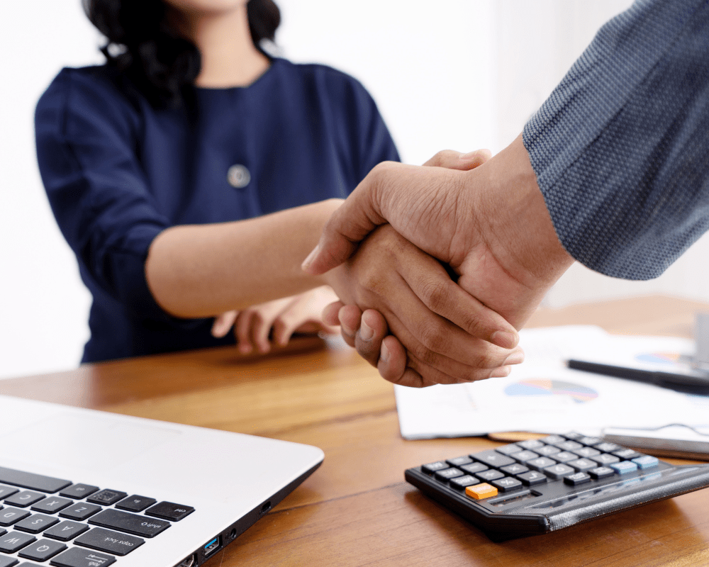 Close up of a business partner shaking hands with a client