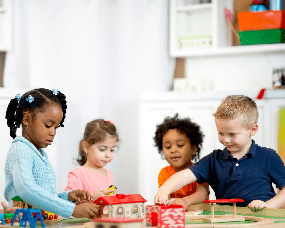 A diverse group of children playing in a preschool classroom