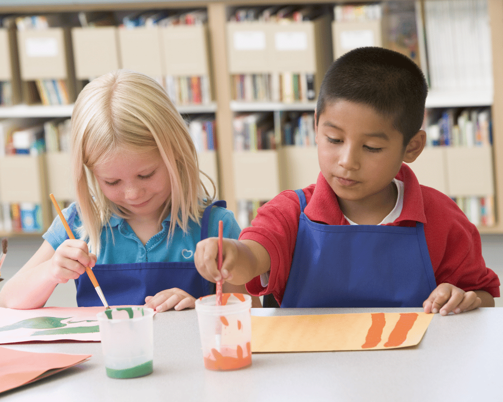 Kindergarten children painting in an art class
