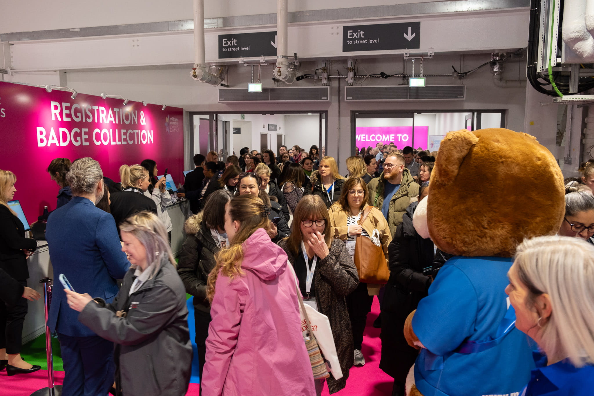 A crowd of visitors entering one of the Childcare & Education Expo shows