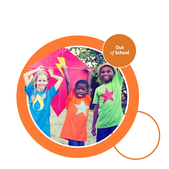 Three children playing with a colourful kite.