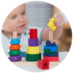 Child playing with stacking rings