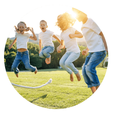 Kids jumping on grass