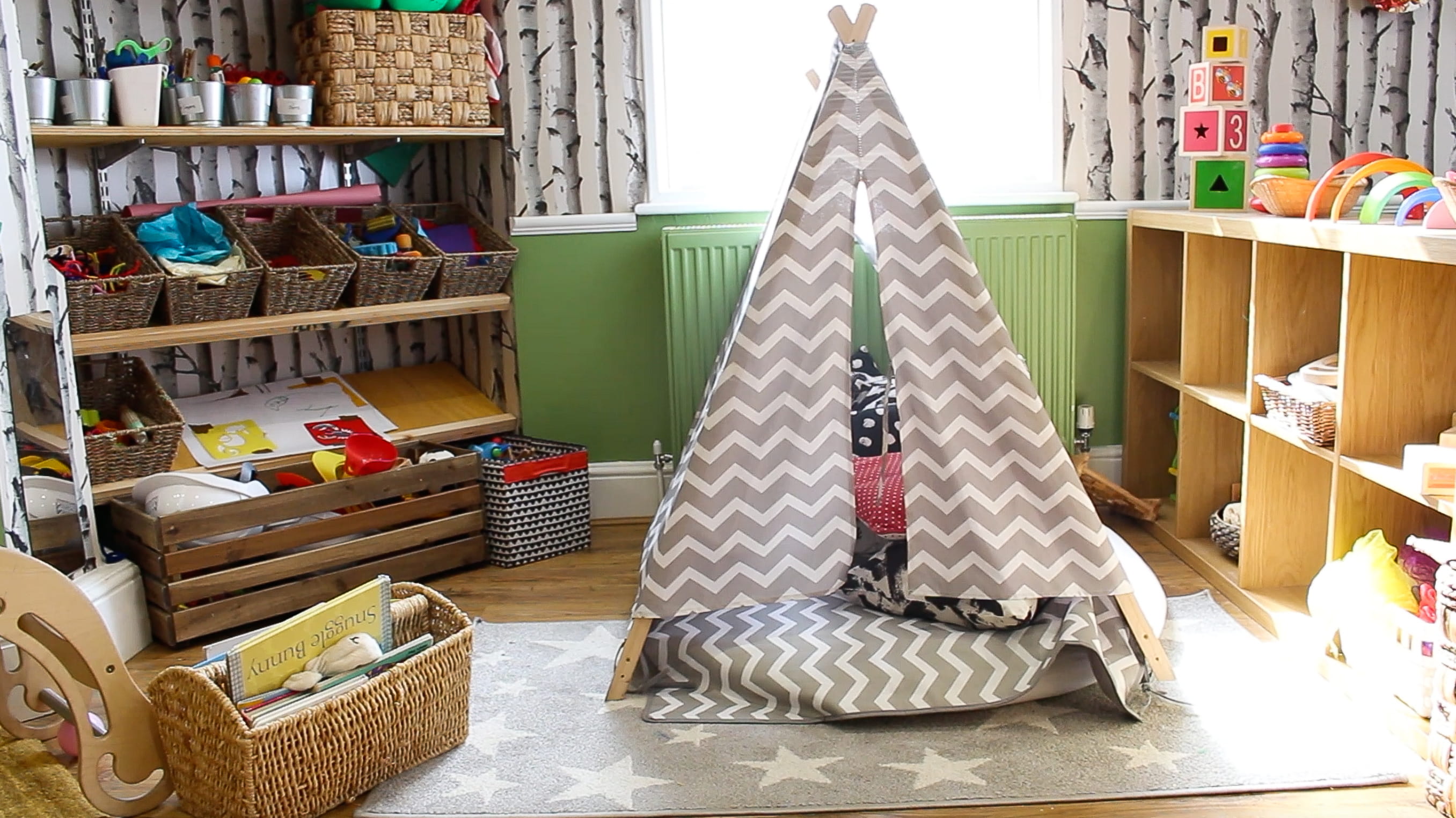 The Butterfly Patch nursery classroom with kids' canopy tent as main focus and kids toys surrounding tent