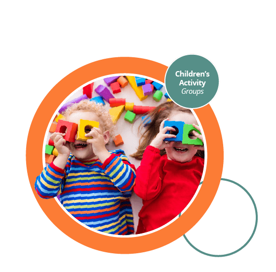Two young children using toy blocks to look through.