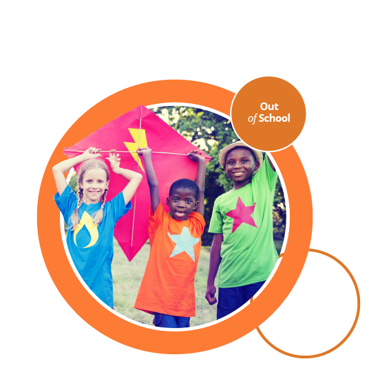 Three children playing with a colourful kite.