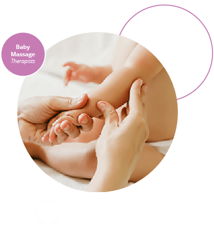 Close up of baby massage therapist's hands massaging baby's hand