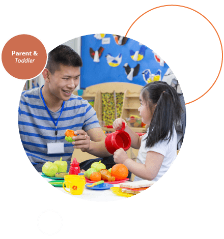 Father and young daughter playing with toys